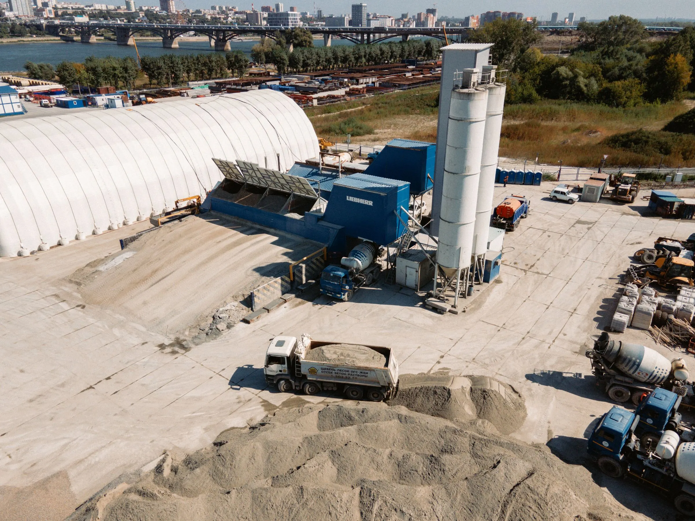 Aerial view of an industrial bulk yard with material stockpiles covered by 3D LiDAR scanning